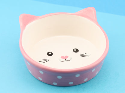 Ceramic cat face bowl, pink with white polka dots and a cute cat face in the centre of the bowl