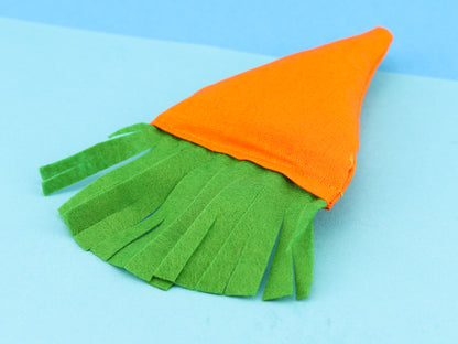 Single image of catnip filled carrot, close up of soft green leaves made from green felt